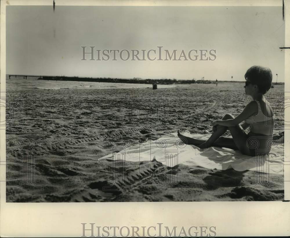 1962 Shirley Labrato does some sunbathing at Pontchartrain Beach. - Historic Images