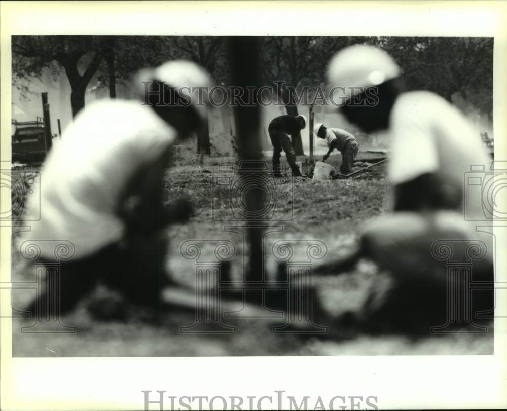 1995 Electricians build the bases for light poles in Lakeshore Drive - Historic Images