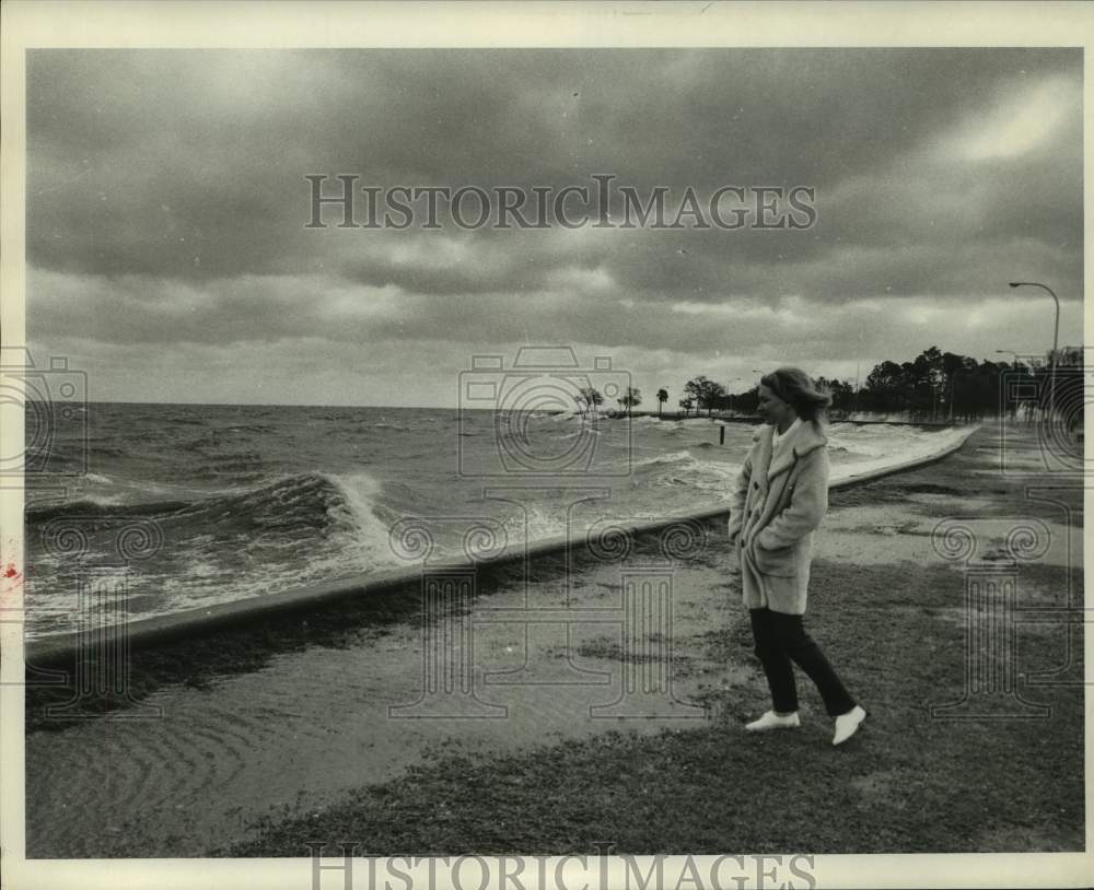 1971 Woman doing a leisurely walk near Lake Pontchartrain Seawall - Historic Images