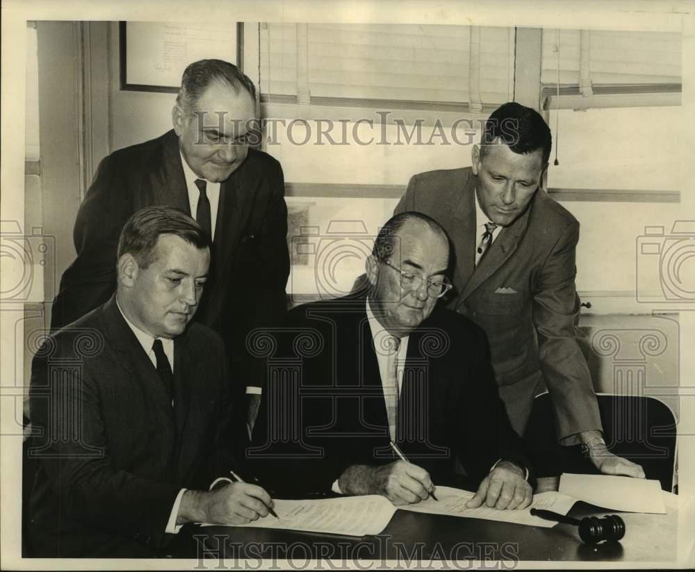 Press Photo Officials at the Causeway Contract Singing at Causeway Toll Plaza - Historic Images