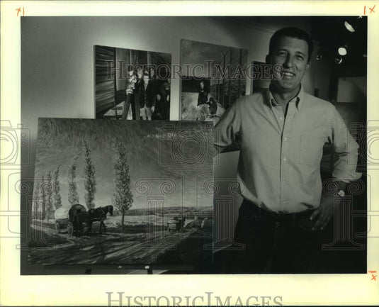 1989 Press Photo Adonph Klundt with some of his paintings depicting his family - Historic Images