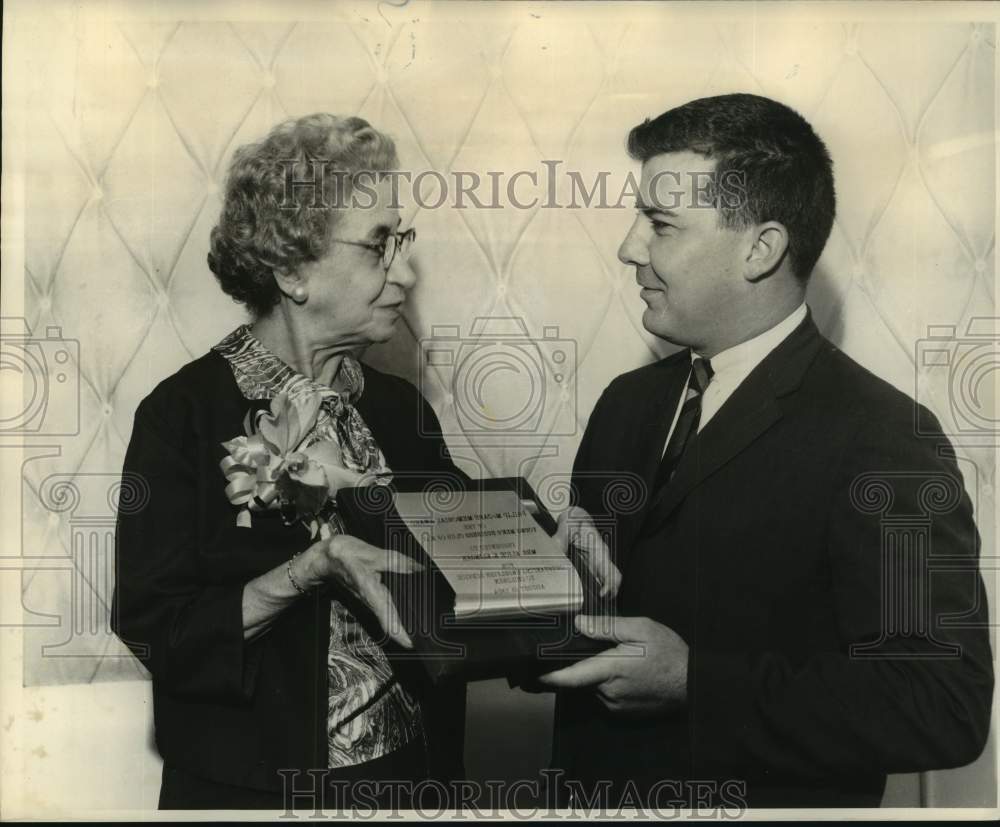 1964 Mrs. Alice Klinger gets Annual plaque from Maurice Hartson III - Historic Images