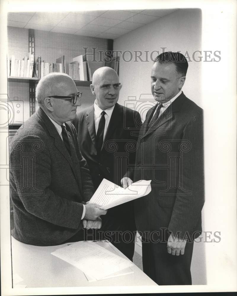1962 Company executives conferring about new business plan-Historic Images