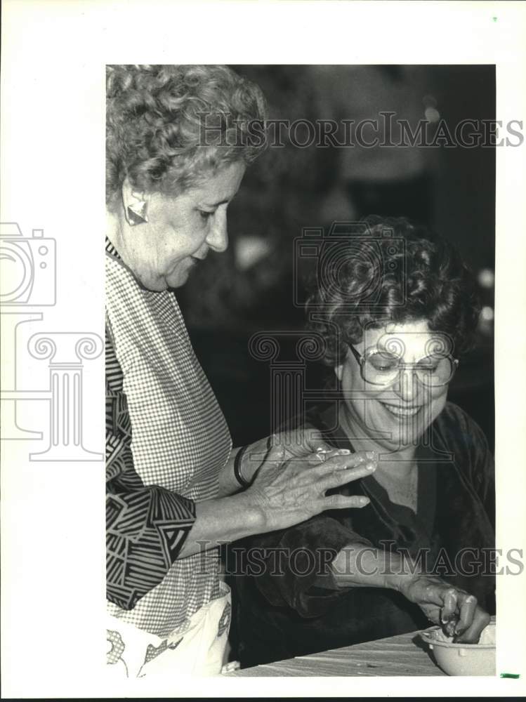 Press Photo Dina Merinello &amp; Camille Madhes selling cookies at Italian Open - Historic Images