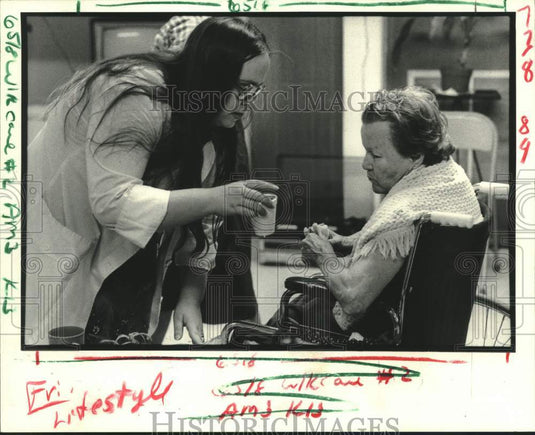 Press Photo Sandra Meche attends to Lucille Dimmen- Kenner Adult Day Care Center - Historic Images