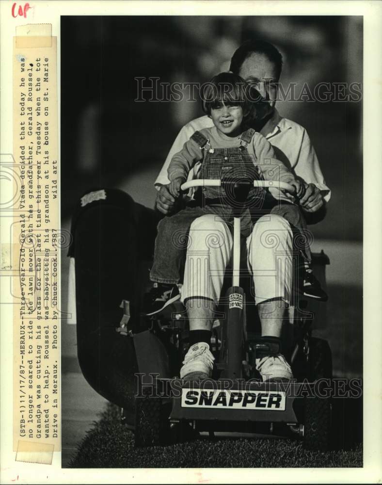 1987 Press Photo Gerald Viada rode lawn mower with grandfather Gerald Roussel - Historic Images