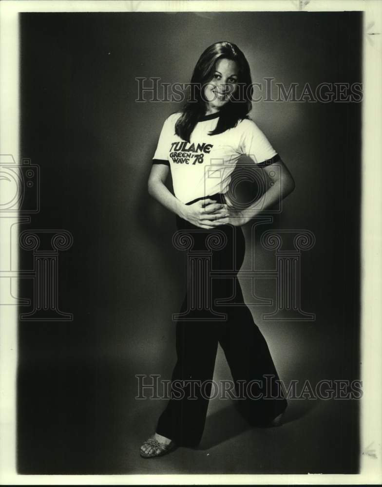 1978 Sharon Larsen models one of the Tulane T-shirts for youngsters - Historic Images