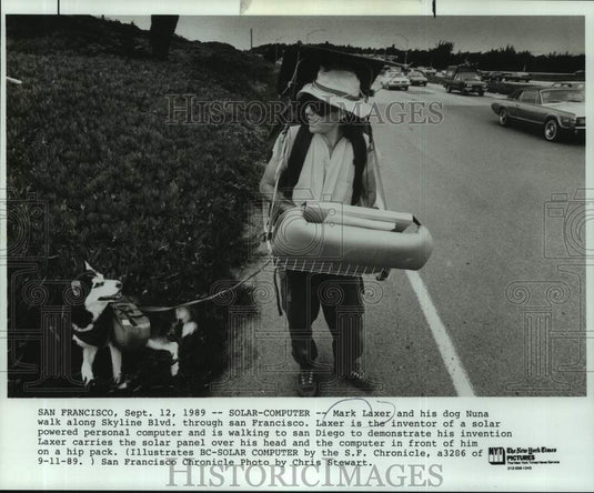1989 Press Photo Mark and his dog Nuna with his solar powered personal computer - Historic Images