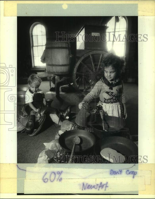 1991 Press Photo James & Maggie play in an old west kitchen at Children's Museum - Historic Images