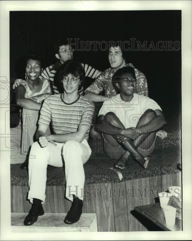 1975 Cast members at rehearsal taking a break. - Historic Images