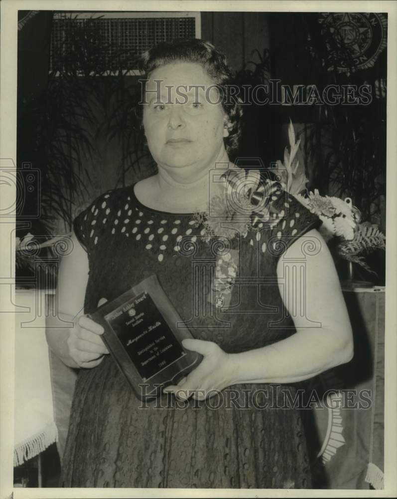 1966 Mrs. Marguerite Leslie holds Thelma Ashley Award - Historic Images