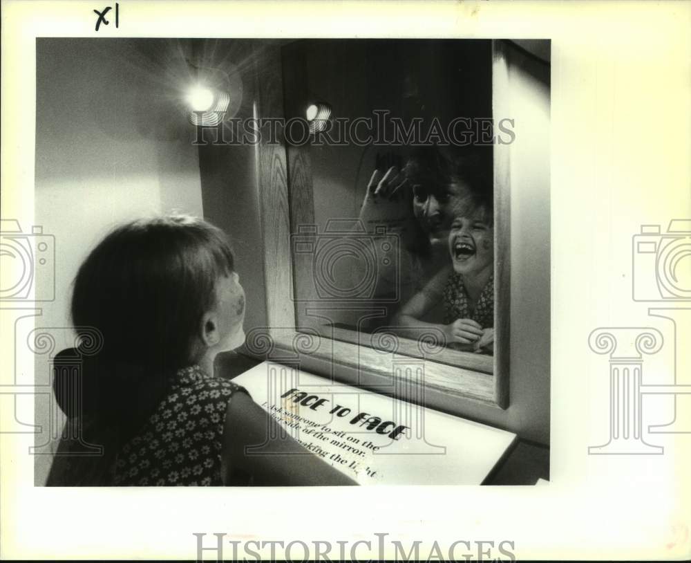 1994 Press Photo Kasie Eckman tries Face to Face at Louisiana Children&#39;s Museum - Historic Images