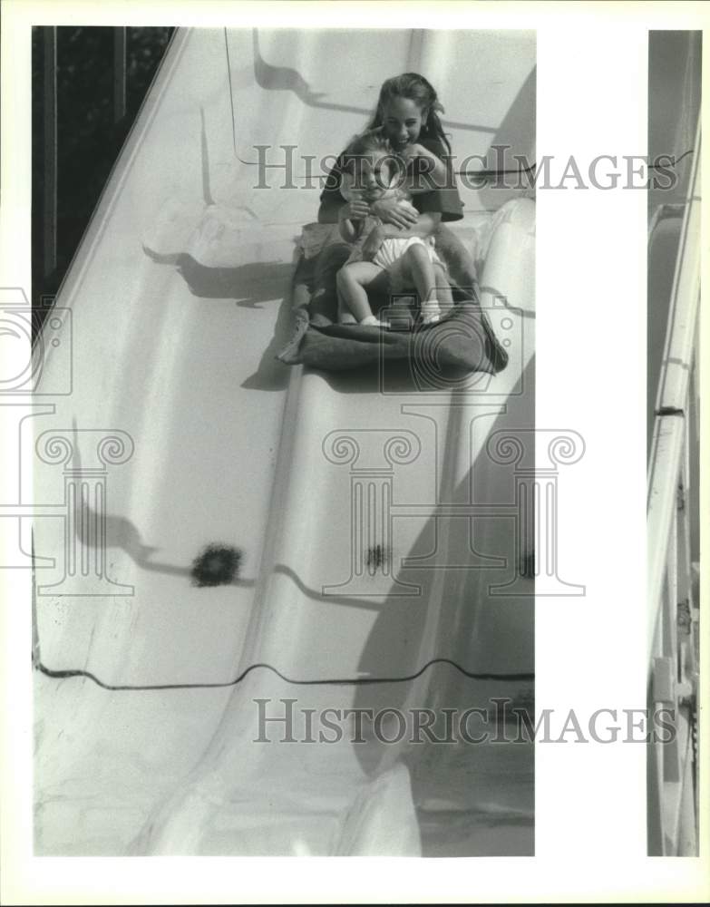 1993 Press Photo Kelly &amp; Payne Oldenburg in slide at Louisiana Shrimp Festival - Historic Images