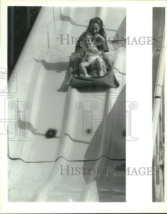 1993 Press Photo Kelly & Payne Oldenburg in slide at Louisiana Shrimp Festival - Historic Images