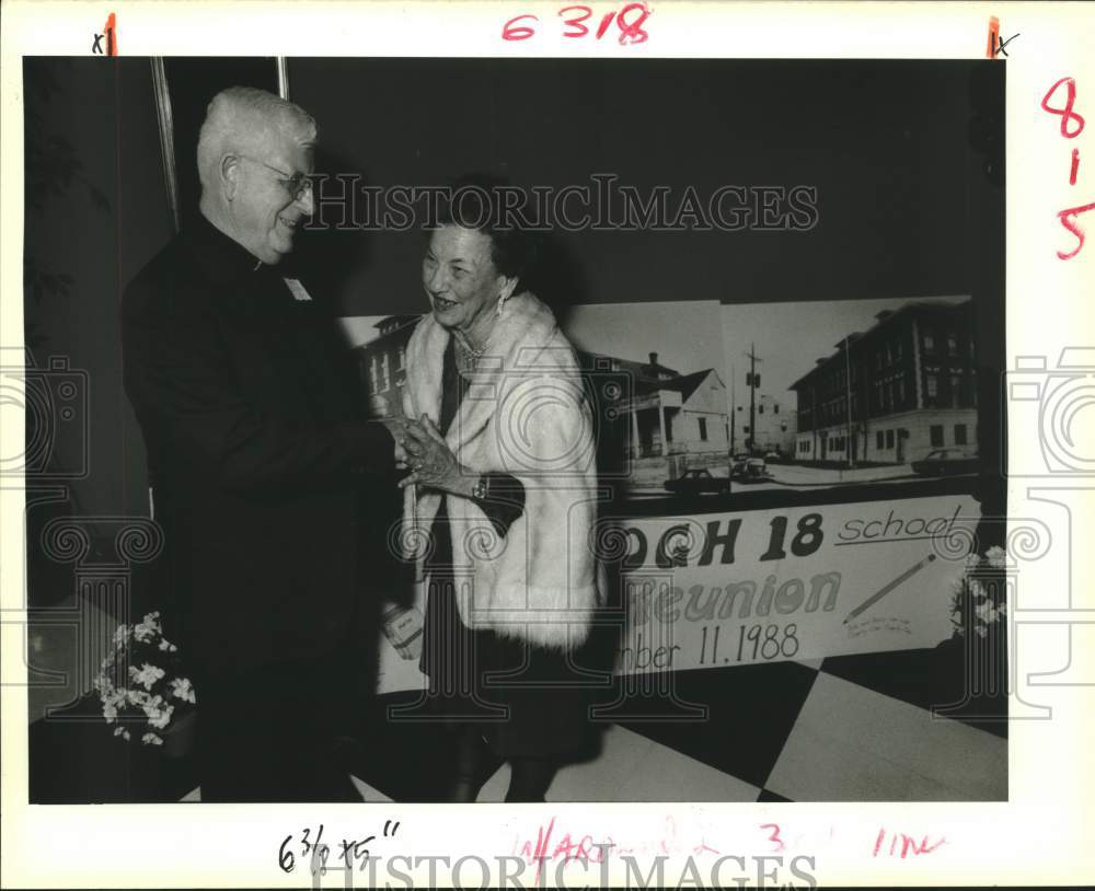 1988 Press Photo Father Claude Boudreaux greets former teacher Mary C. Morris - Historic Images