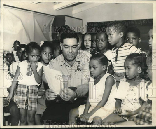 1966 Patrolman Ronnie Lauland with "Head Start" program children - Historic Images