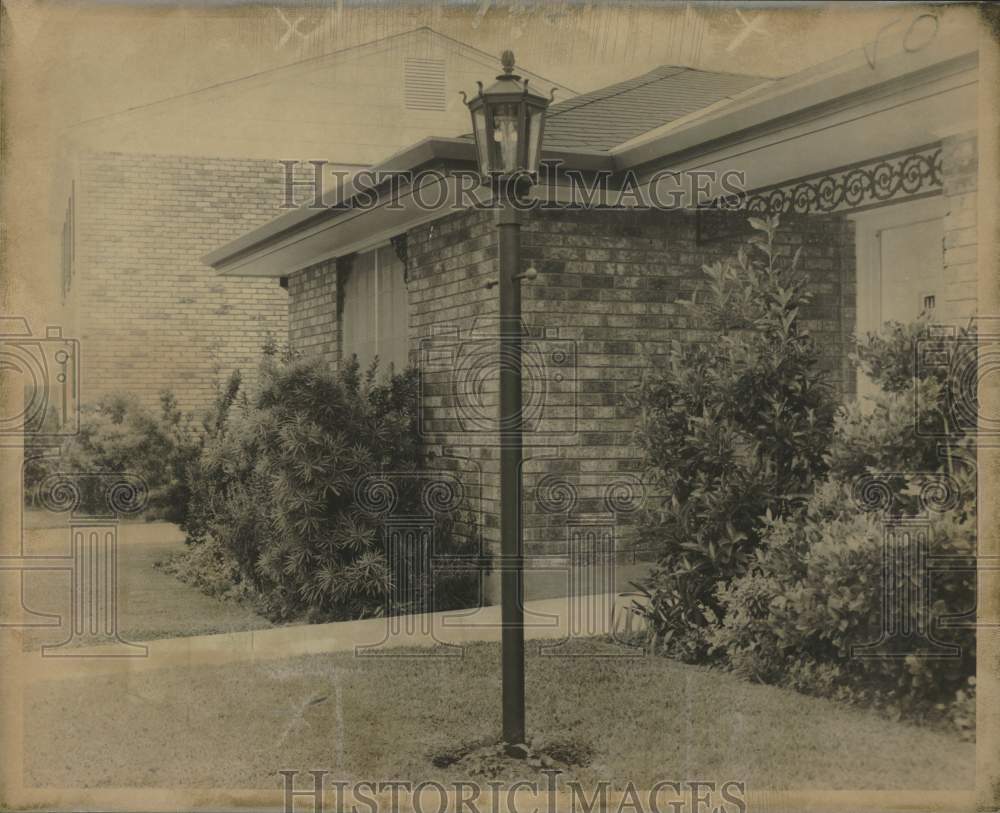 1970 Charmglow model 900 Spanish style gaslight outside the house - Historic Images