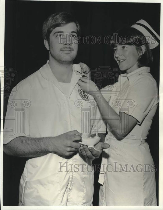 Press Photo Maureen Movius pins the chevron to James Ott of New Orleans-Historic Images