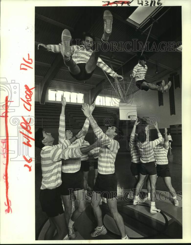 1987 Press Photo Holy Cross cheer leading squad demonstrates &quot;Basket&quot; maneuver - Historic Images