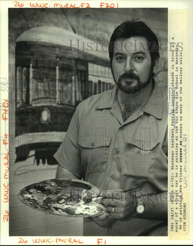 Press Photo Patrick Langley, painting murals on the Vic Pitre Elementary School - Historic Images