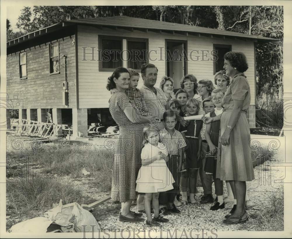 1962 Forrest Kieff &amp; family receive check from Mrs. Lillian Winkler - Historic Images