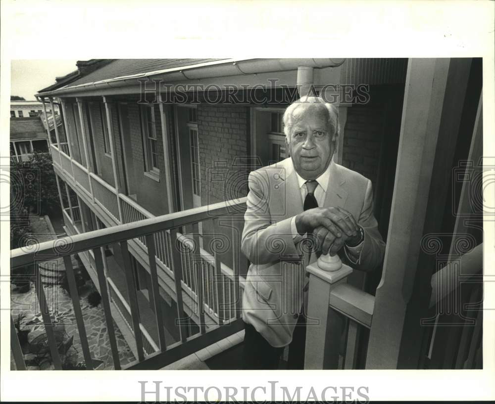 1987 Press Photo Olaf Lambert, on the balcony of the 3rd floor of Grenoble House - Historic Images