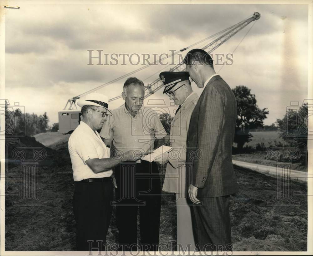 Building officials at site of Lafourche Levee District construction - Historic Images