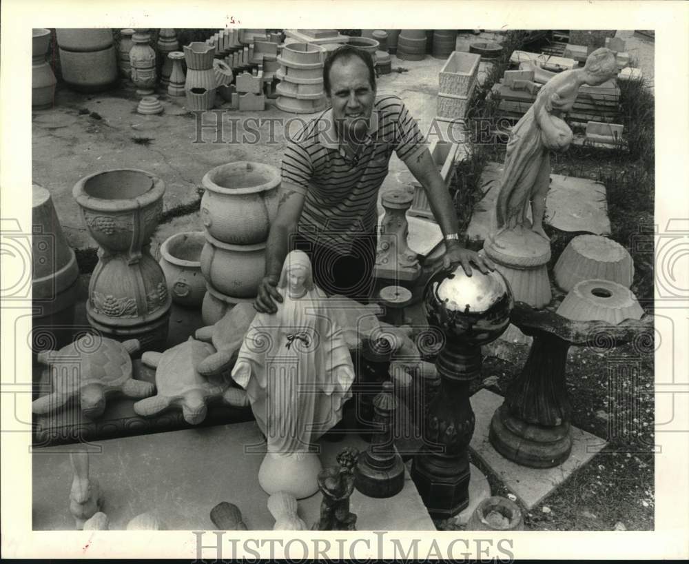 1987 Press Photo Leo LaFrance, Jr. stands amidst Blessed Virgin Mary statue - Historic Images