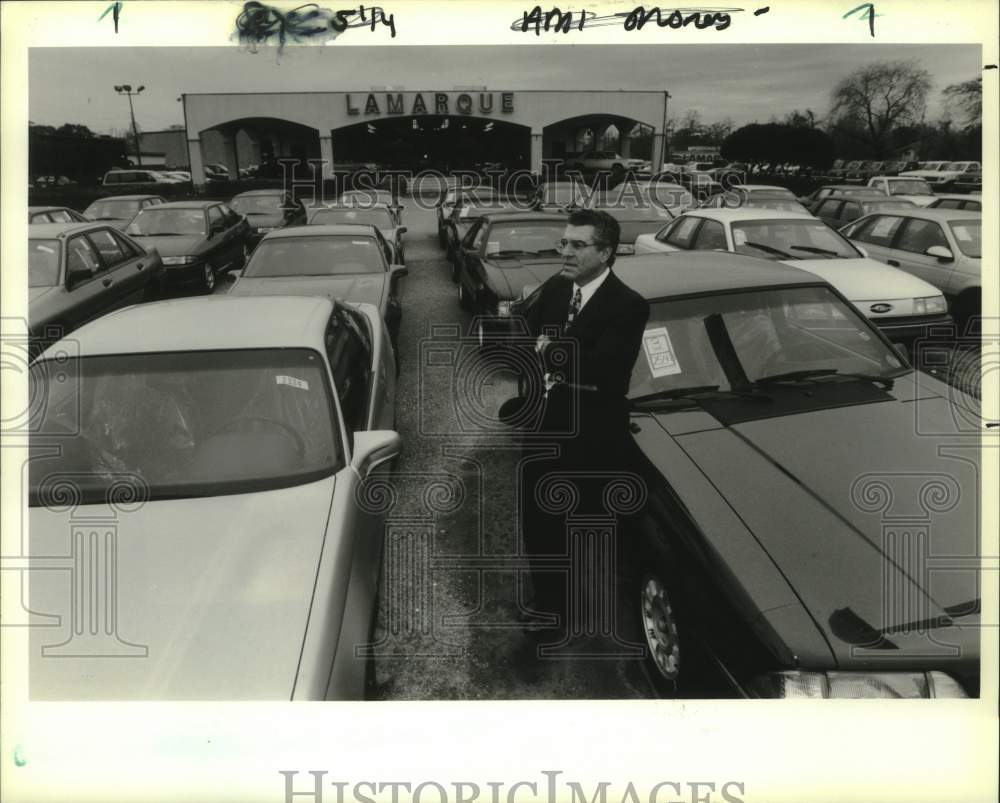 1991 Press Photo Ronnie Lamarque in front of his Ford Dealership in Kenner - Historic Images