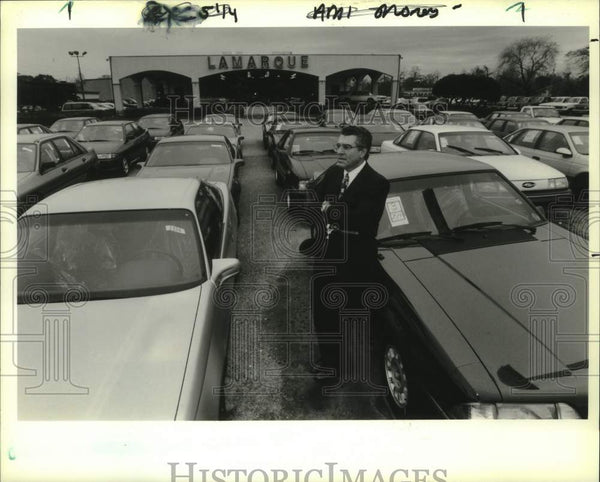 1991 Press Photo Ronnie Lamarque in front of his Ford Dealership in Ke ...