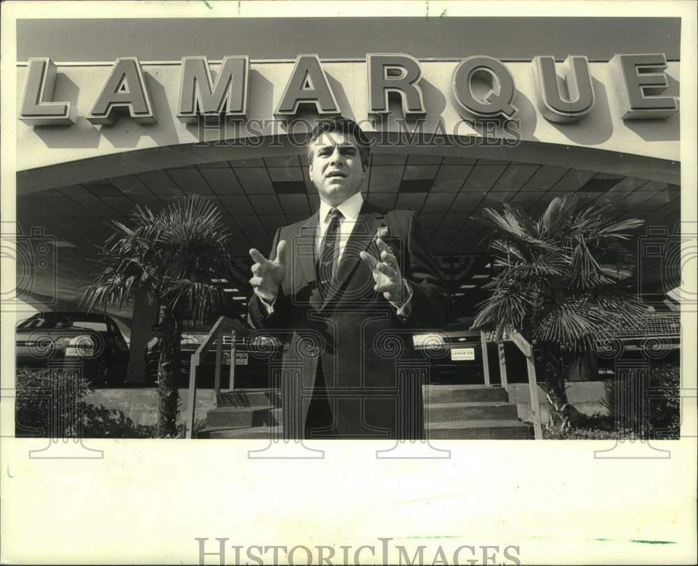 1987 Press Photo Ronnie Lamarque outside his Williams Boulevard Ford Dealership - Historic Images