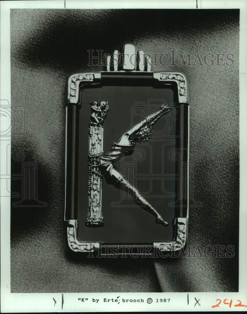 1987 Press Photo &quot;K&quot; by Erte; brooch jewelry - Historic Images