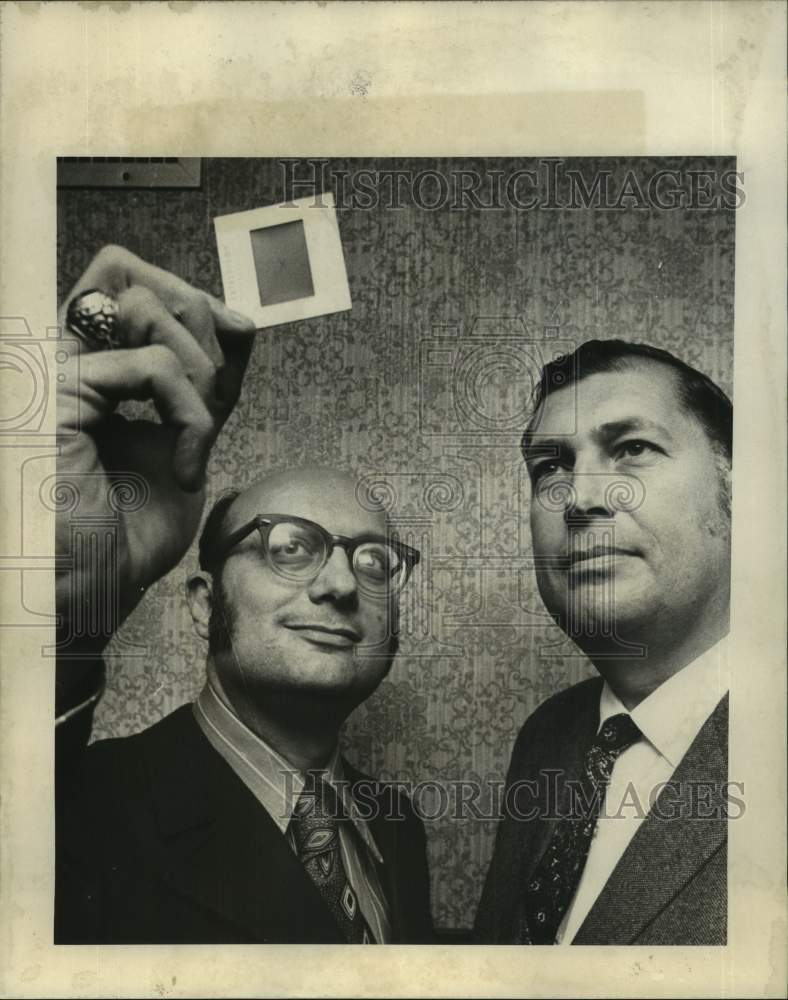 1971 Nathan L. Kern, M.D and Felix Cuneo Jr. are viewing slide - Historic Images