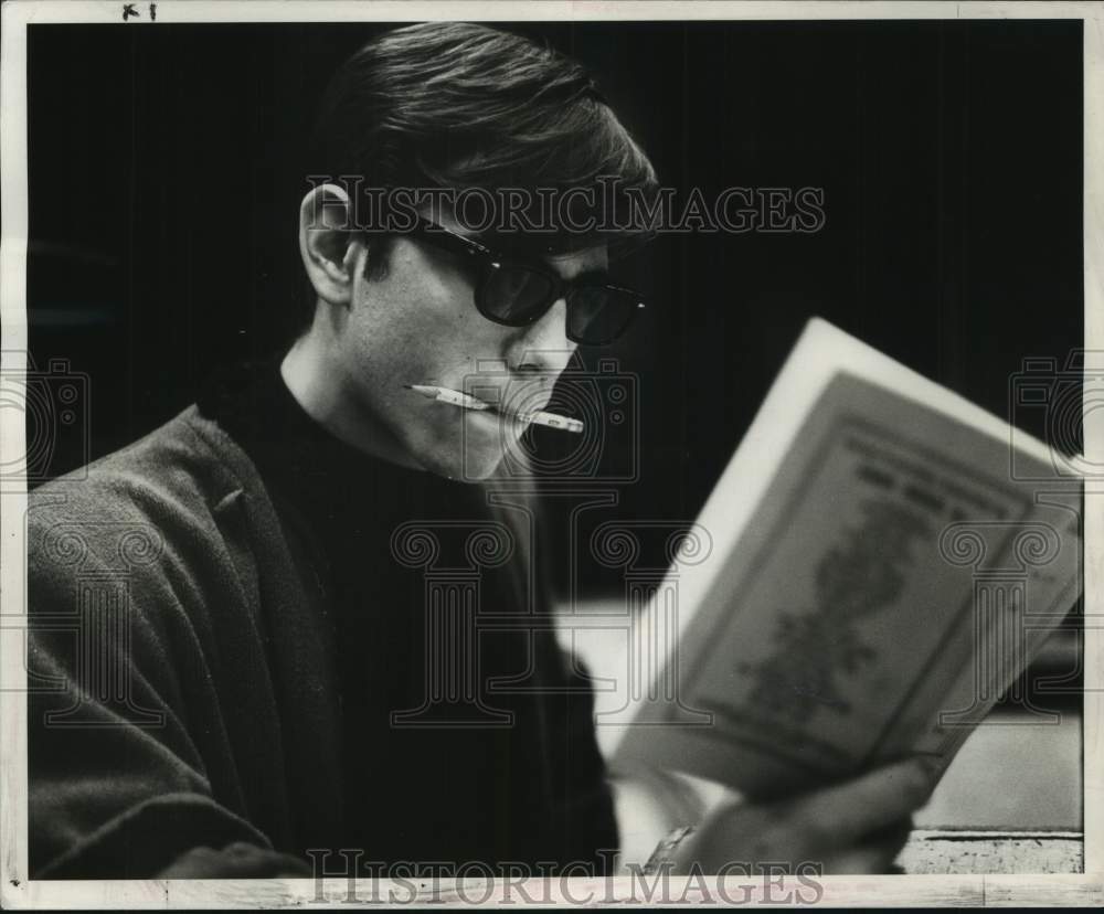 1968 Jesuit student Wayne Fontana studies lines for role in play - Historic Images