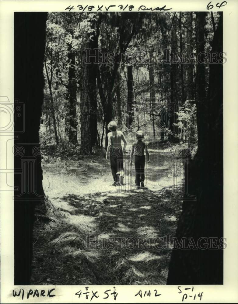 1980 Alan and Johnny Zeringue stroll the woods south of Slidell.-Historic Images