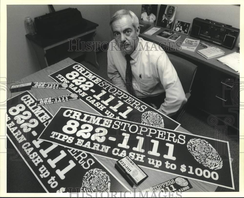 1991 Press Photo NOPD&#39;s John Marie with Crimestoppers paraphernalia - Historic Images