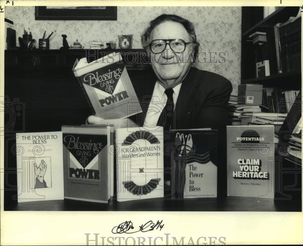 1990 Press Photo Mayron Madden with the books he has written - Historic Images