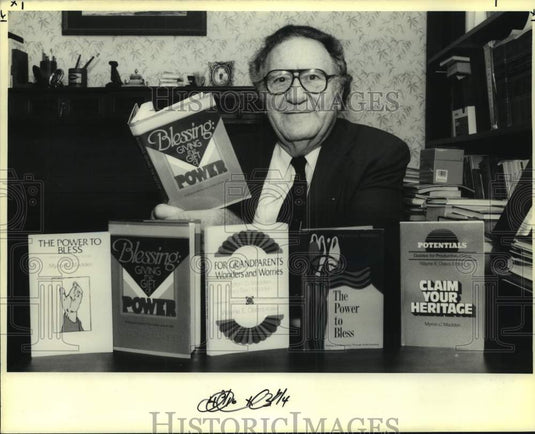 1990 Press Photo Mayron Madden with the books he has written - Historic Images