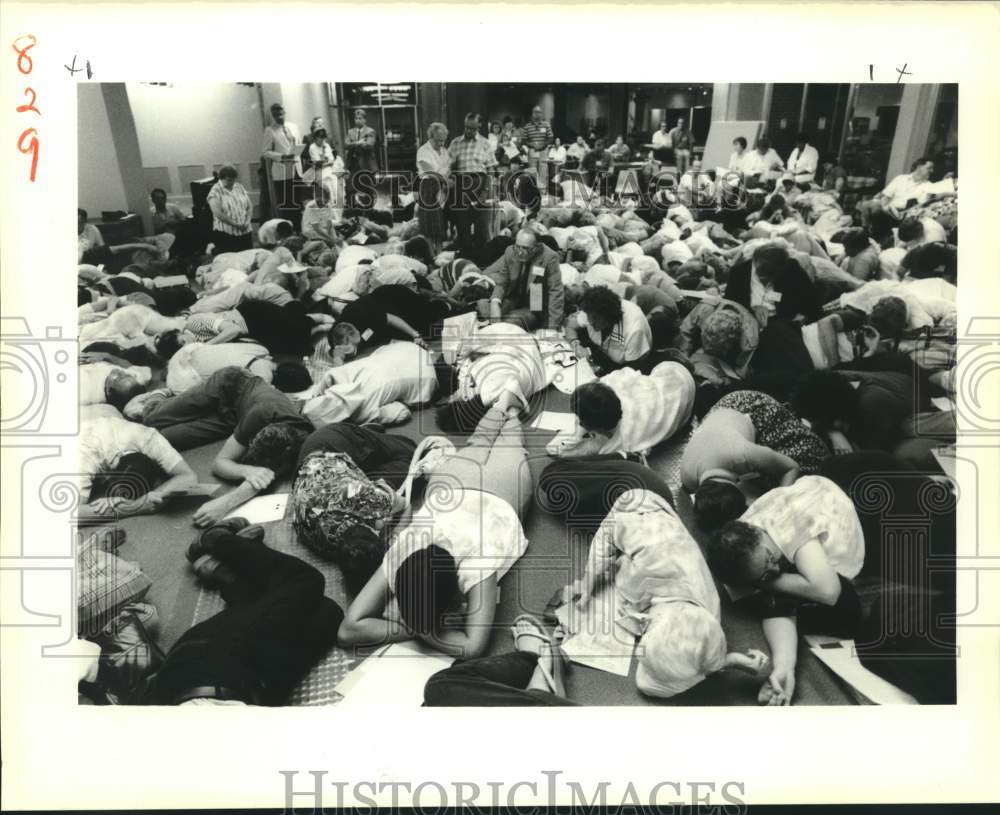 1988 Press Photo Participants stage a die-in at Dana Center at Loyola University - Historic Images