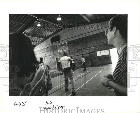 1993 Press Photo A student moons teachers in the gym at John Martyn High School - Historic Images
