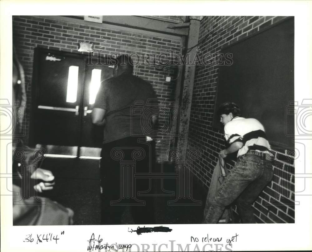 Press Photo John Martyn High School student crumples to the wall after the fight - Historic Images