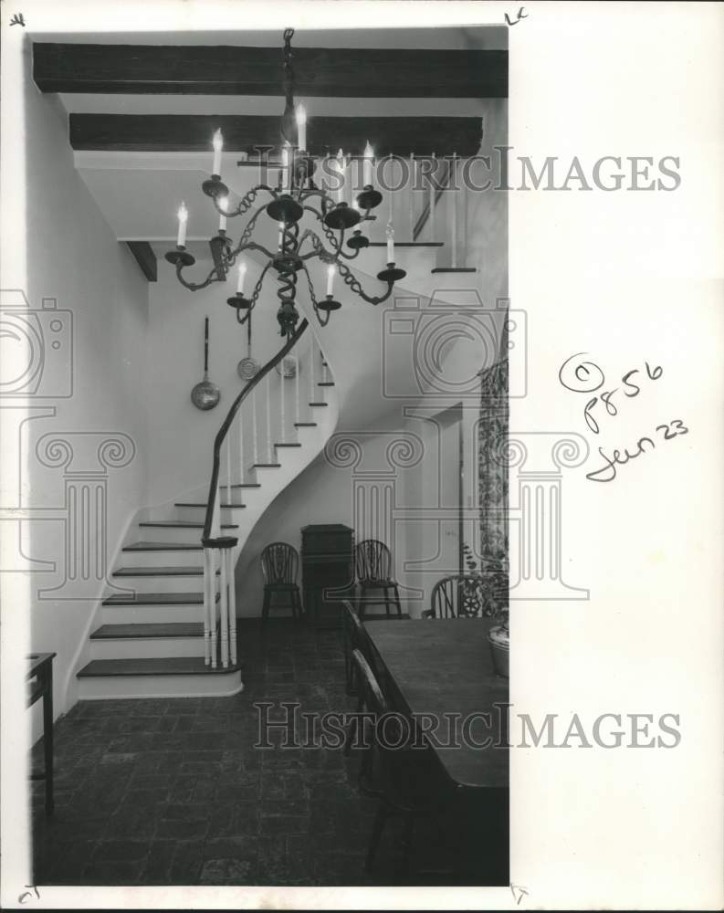 1968 Entrance dining room with &quot;dancing stair&quot; and chandelier - Historic Images