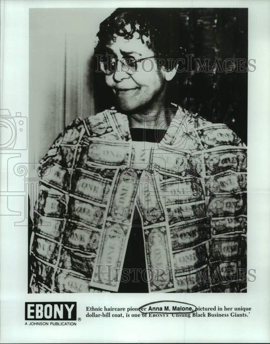 1990 Press Photo Ethnic haircare pioneer Anna M. Malone in her dollar-bill coat - Historic Images