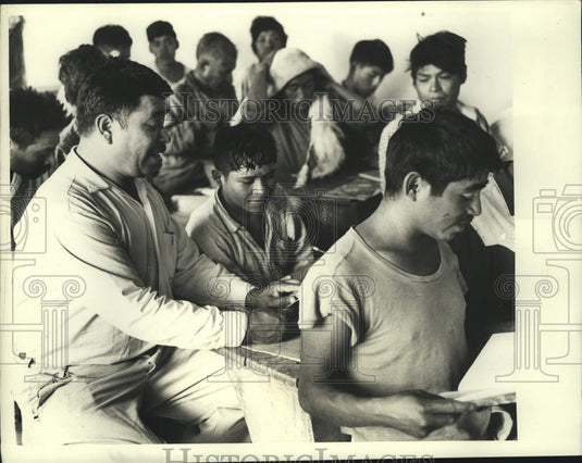 1969 Teacher Hernandez helps a teenage student in Mexico - Historic Images