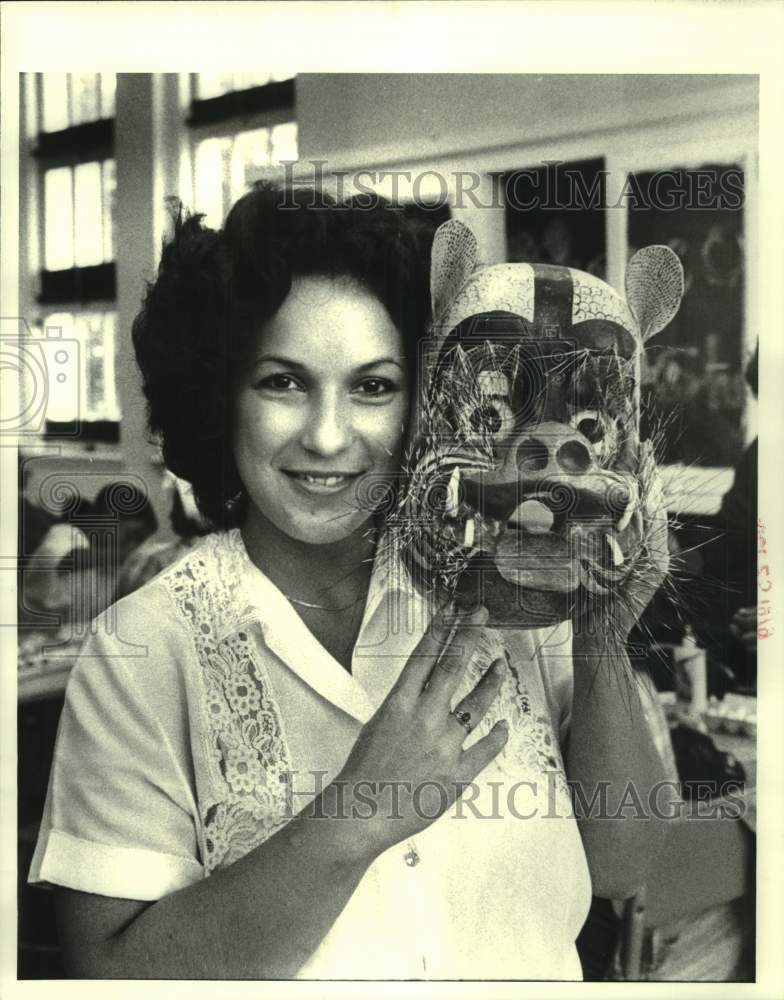 Juana Guzman shows Mask designed - Historic Images