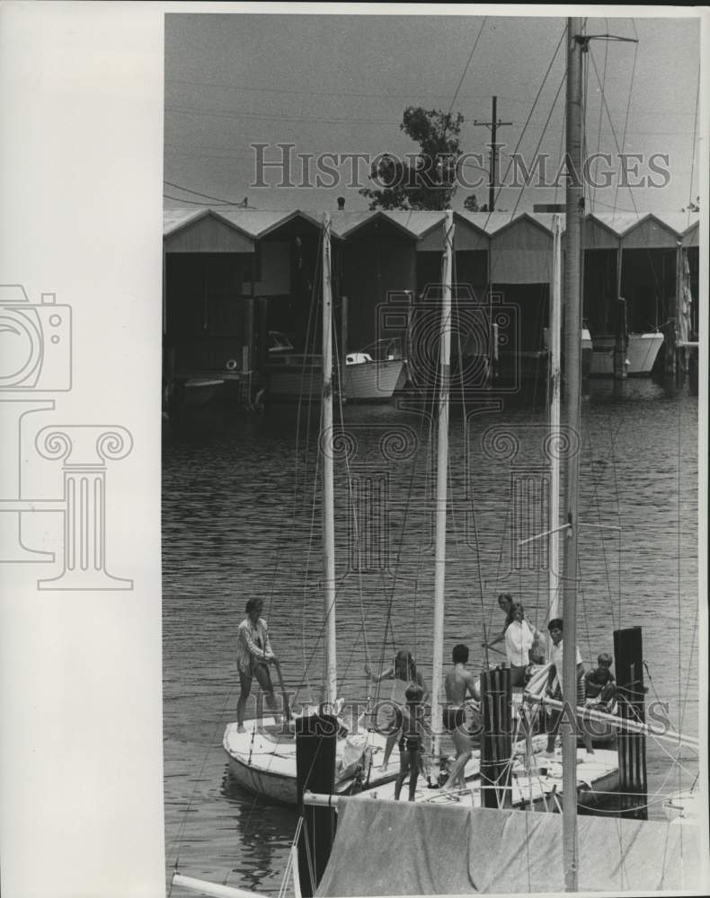 1969 Class attempting to dock fishing boats - Historic Images