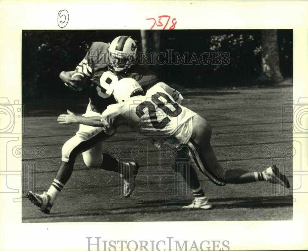 1987 Press Photo Erik Wismar stops Chris Verret during football game - nob93724 - Historic Images