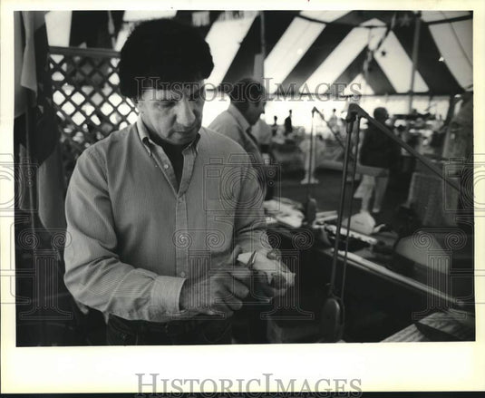 1990 Roy Parfait carves fish at New Orleans Festival in Louisiana - Historic Images