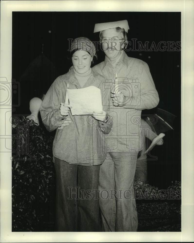 1976 Patio Planters members caroling at Christmas - Historic Images