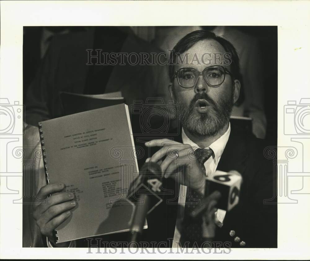 1986 ACLU attorney William Quigley holds 43-page objection. - Historic Images